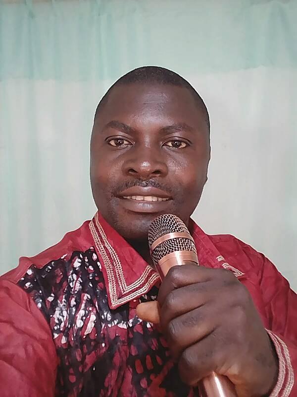 Potrait photo of Nforngang Jude with Microphone